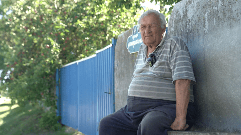 Anatoliy sits by his home after returning from a doctor's visit